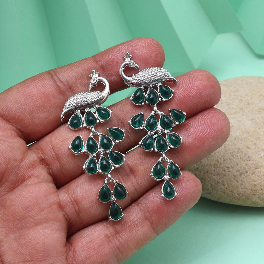 Green Color Fashion Earrings With Detailed Craftsmanship And Artistic Flair Jewellery GetGlit