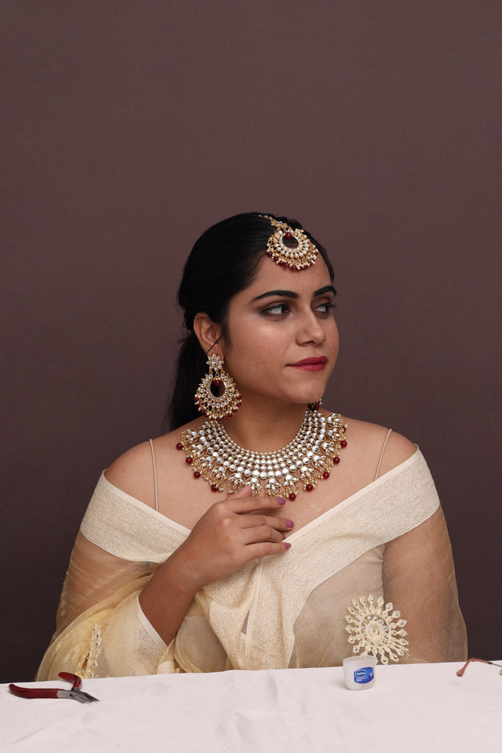 Maroon Color Imitation Pearl Kundan Necklace With Earrings & Maang Tikka For Women Jewellery GetGlit